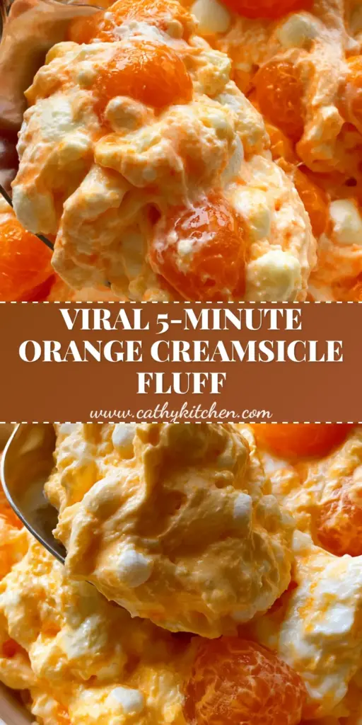 A top-down view of Orange Fluff Salad in a white bowl garnished with mint and mandarin segments.