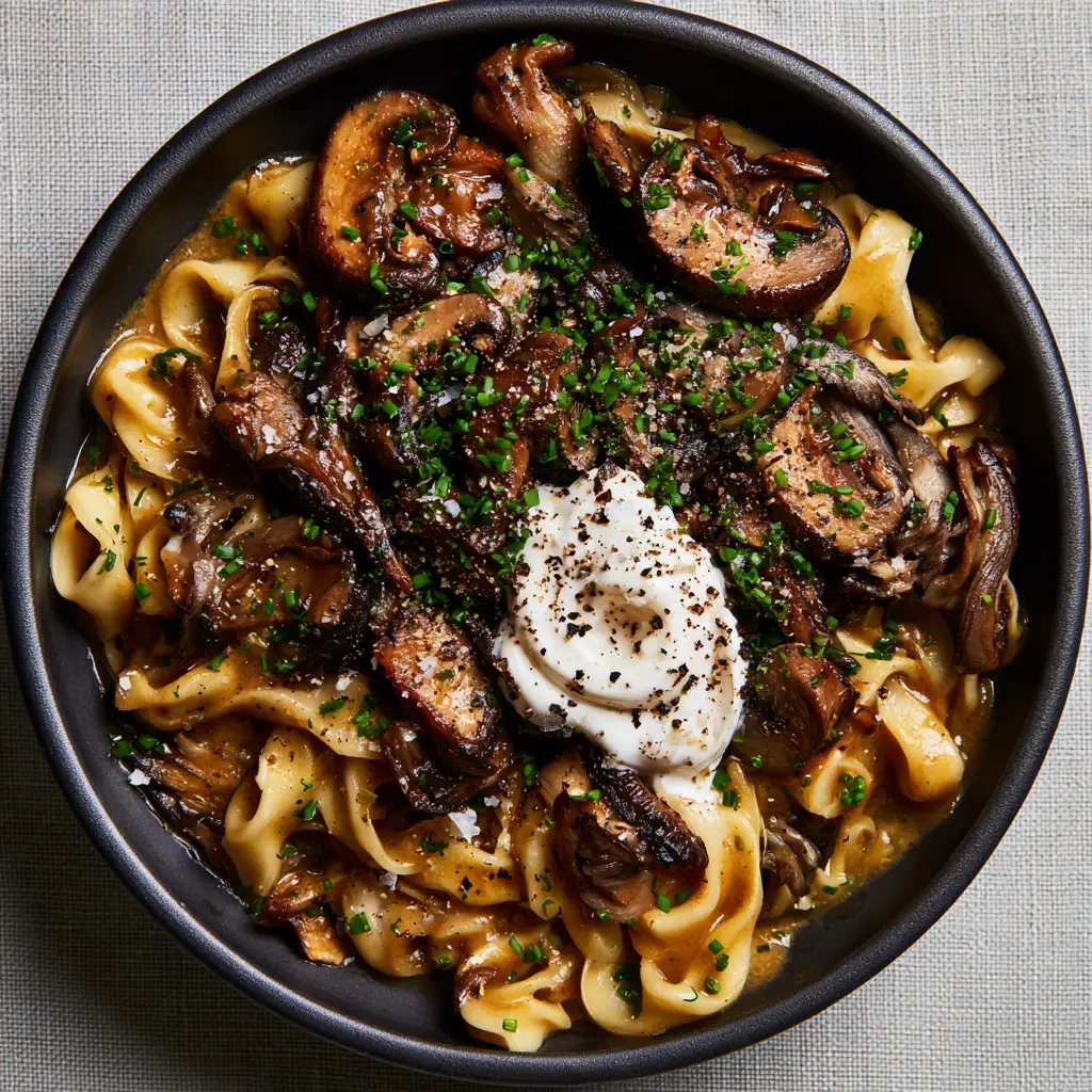 Mushroom Stroganoff Recipe: The Ultimate Creamy Umami Comfort Food 2 Top-down macro shot of mushroom stroganoff recipe showing glossy sauce and caramelized mushroom edges.